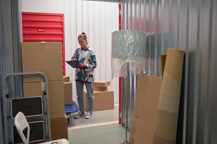 Woman checking boxes in a storage unit in Capitola, CA
