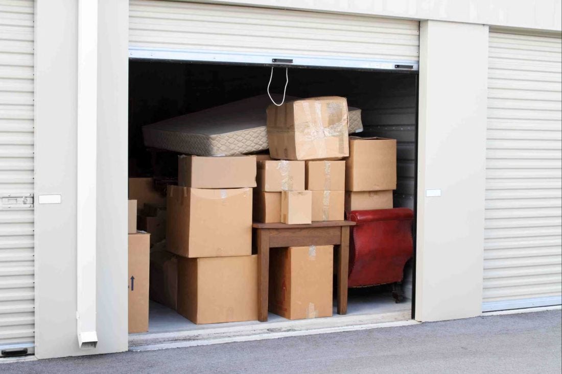 Storage unit filled with cardboard boxes, a mattress, and furniture Storage unit filled with cardboard boxes, a mattress, and furniture in Capitola, CA