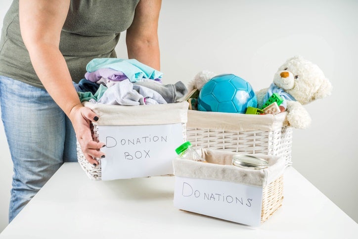 Clothing and toy donation boxes on a table in Capitola, CA