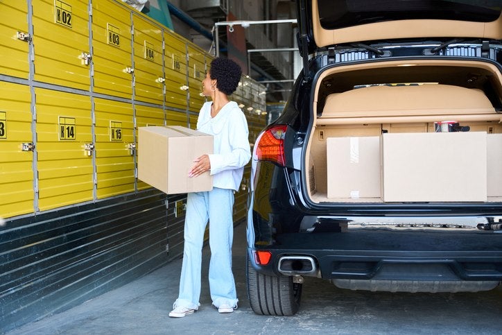 Woman loading boxes into a self-storage unit in Capitola, CA
